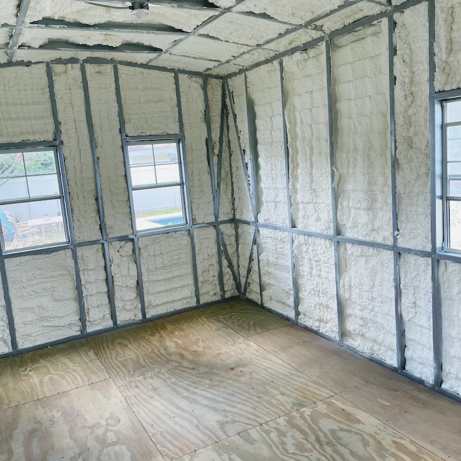Closed-cell spray foam insulation applied to wall cavities in a residential project in Sansom Park